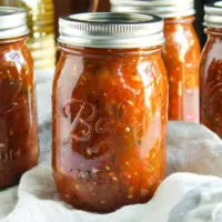 Jars of canned fire roasted salsa.