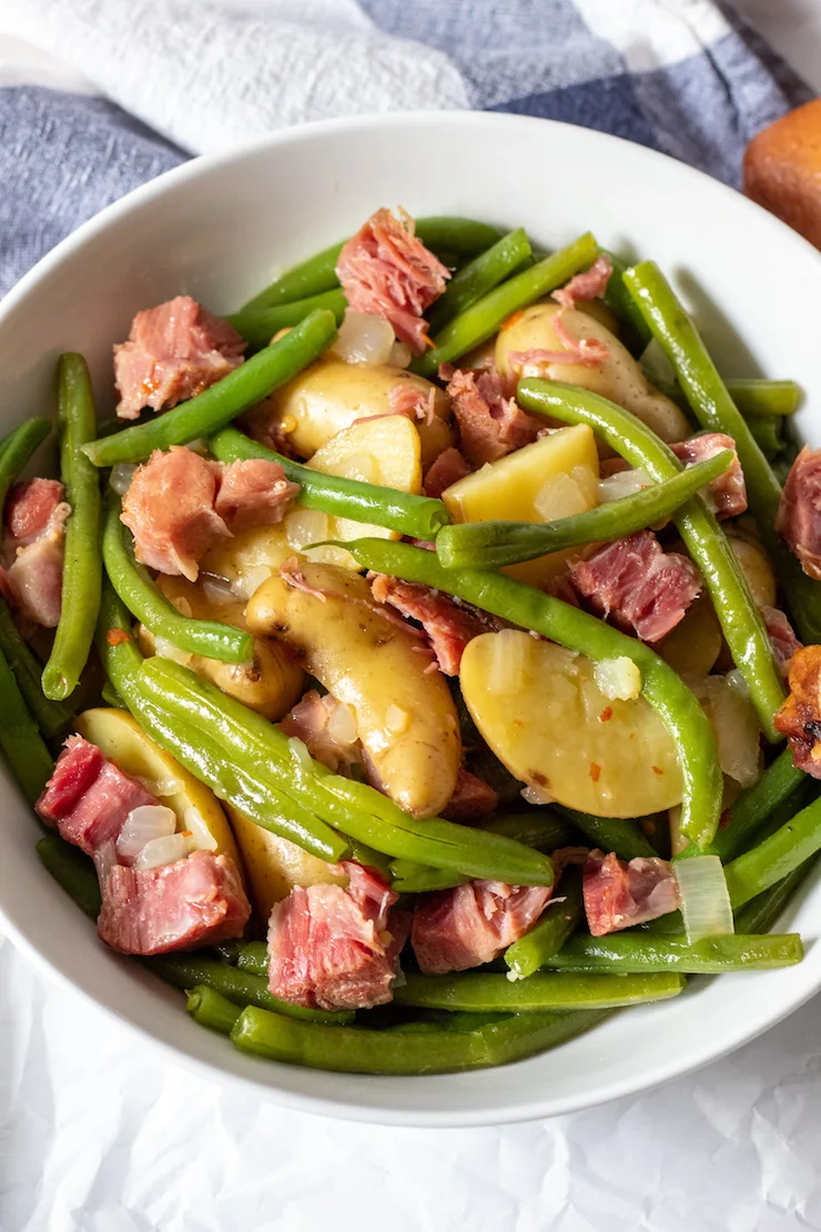 Country green beans and potztoes in serving bowl.