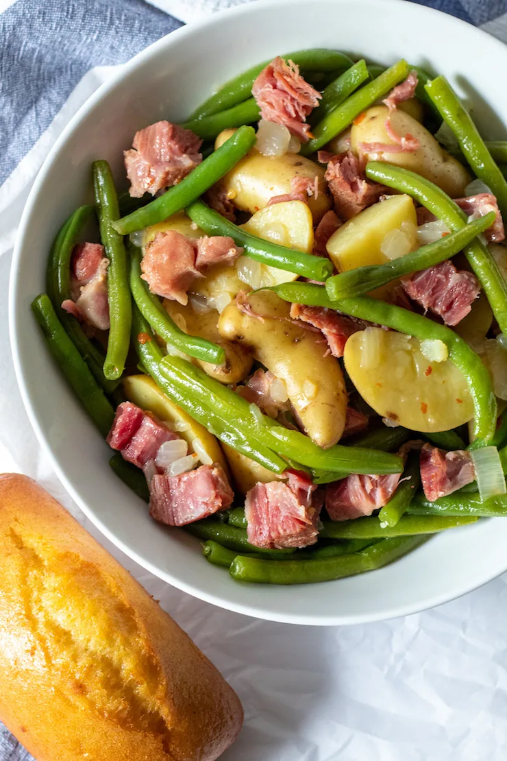 Instant Pot green beans, potatoes and ham in serving bowl.