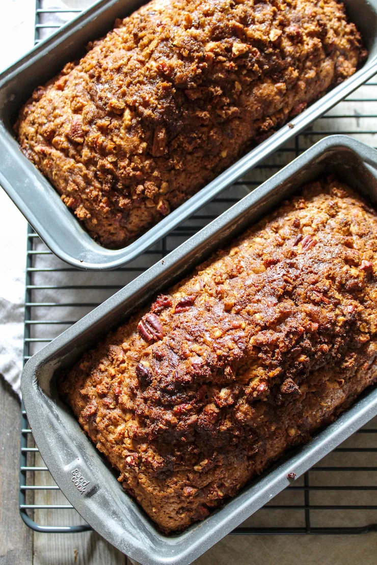 Two loaves cooling in pans.