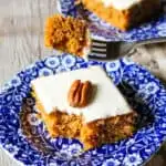 Pumpkin bar on blue plate with piece on fork.