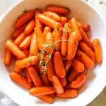 Honey brown sugar glazed carrots in serving bowl.