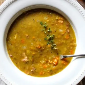 Soup in serving bowl with spoon.