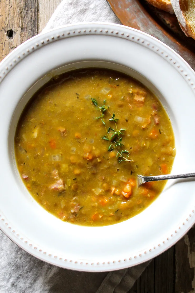 Soup in serving bowl with spoon.