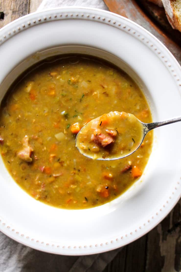 Split Pea and Lentil Soup in bowl with spoonful raised above.