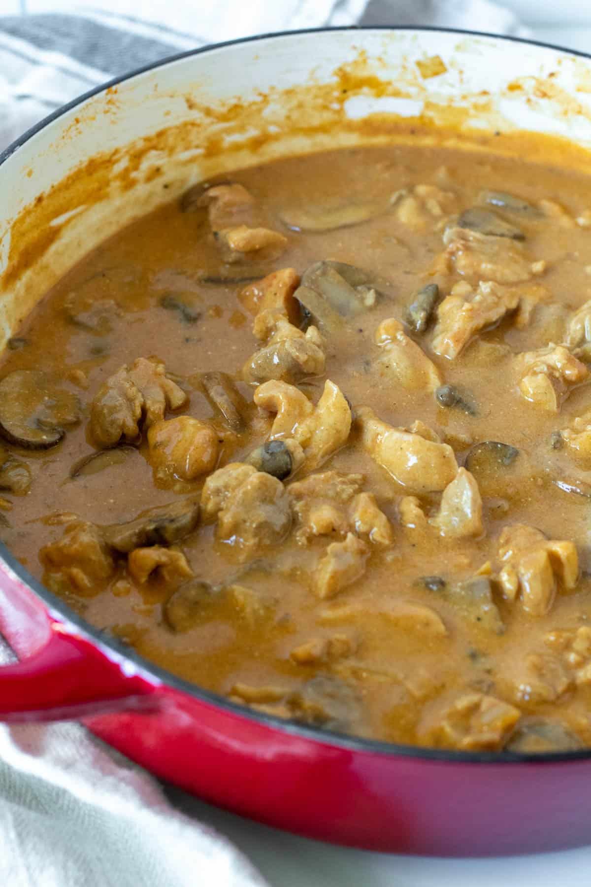 Skillet of finished creamy chicken stroganoff.