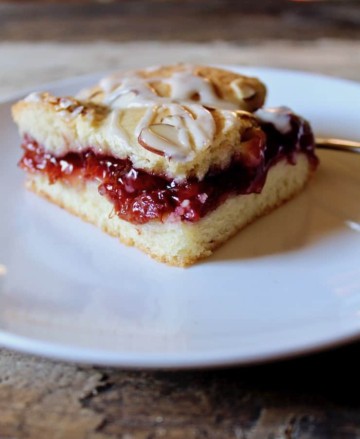 Cherry Pie Bars With Vanilla Glaze And Almonds