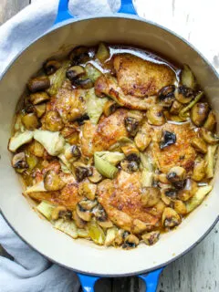 Overhead photo of chicken and artichokes with sherry mushroom sauce.