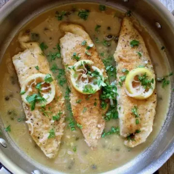 Overhead of Tilapia Piccata in skillet