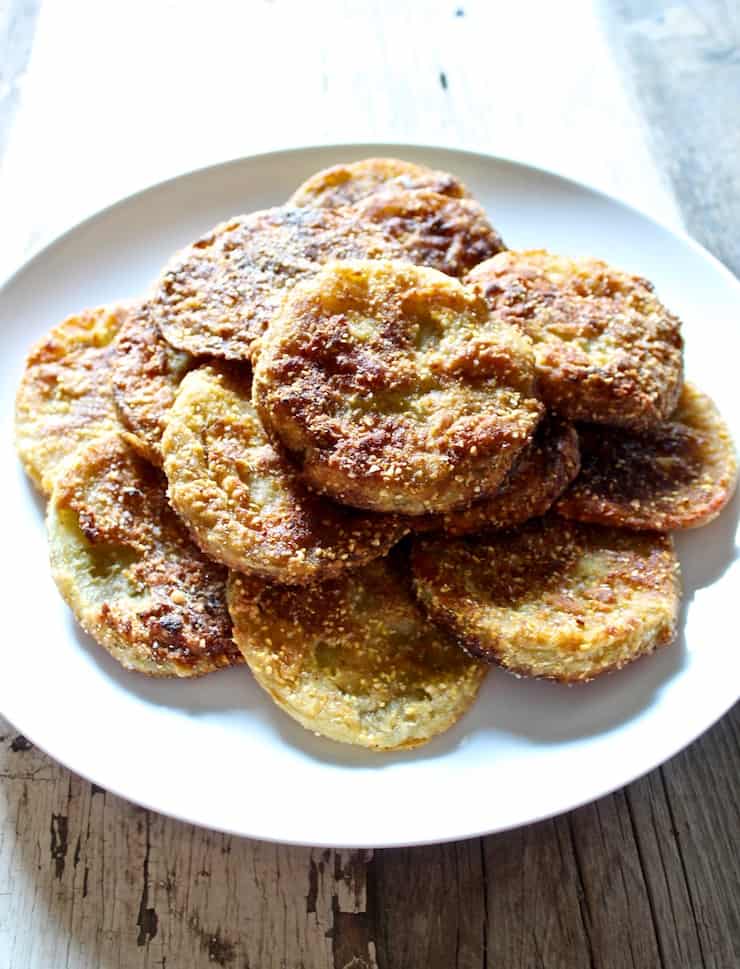 Southern fried green tomatoes, on a white plate