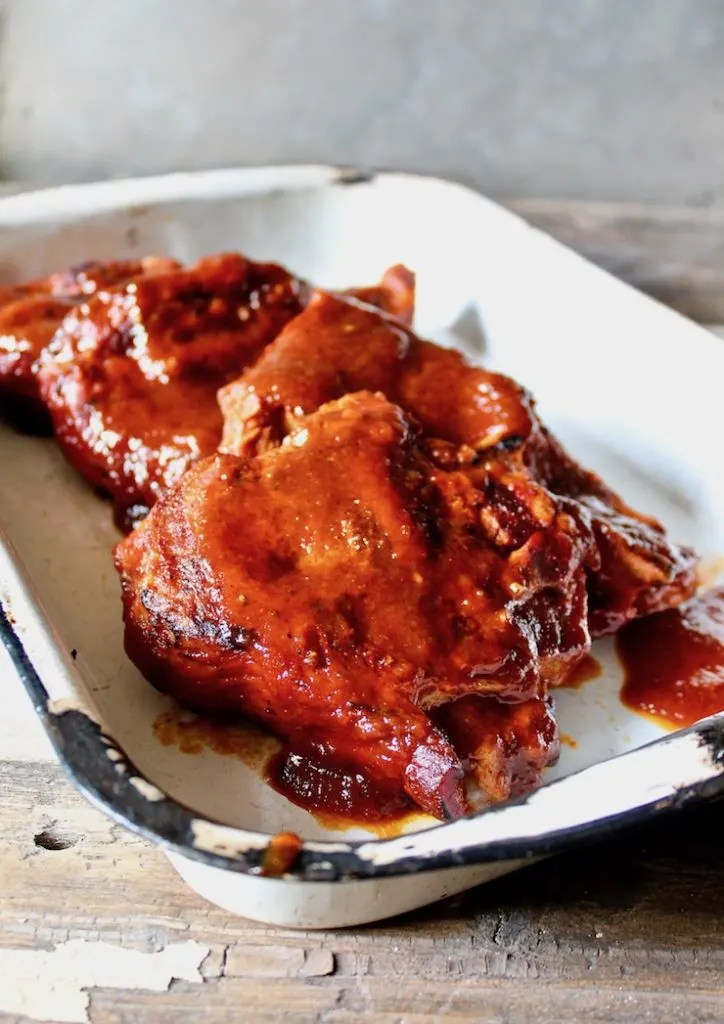 St. Louis BBQ Pork Steaks close up shot in serving pan.