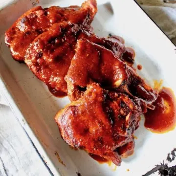 St. Louis BBQ Pork Steaks in an enamel pan for serving