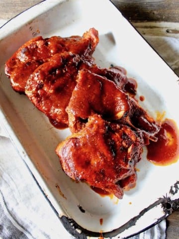 St. Louis BBQ Pork Steaks in an enamel pan for serving
