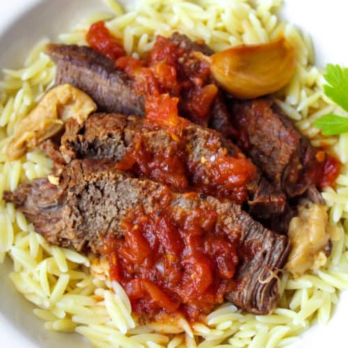 Pot roast served over orzo pasta.