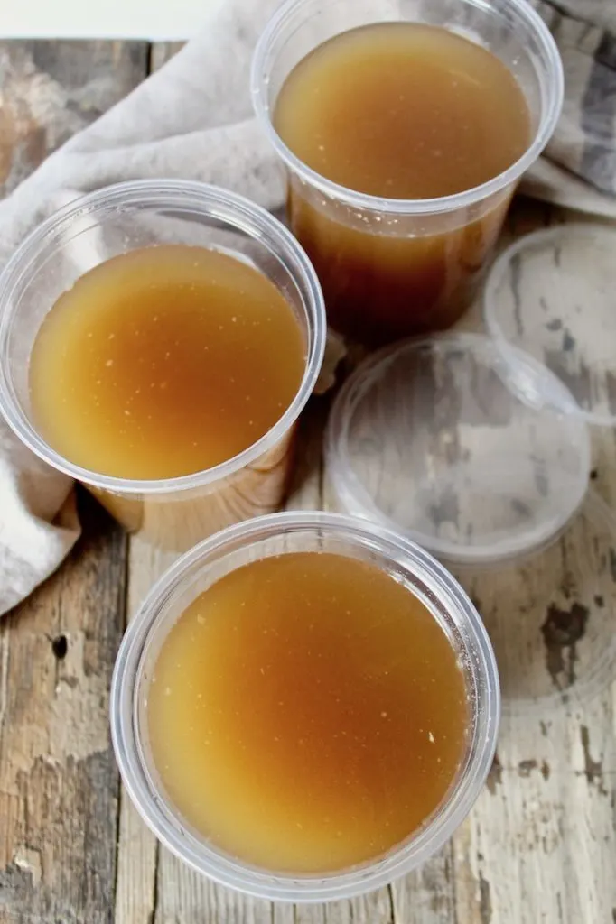 Homemade Turkey Stock, overhead photo of stock in plastic quart containers