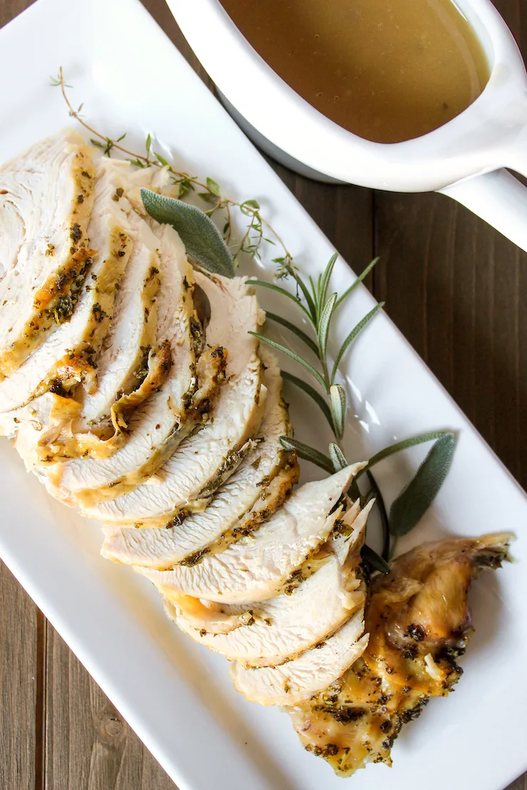 Instant Pot turkey breast with gravy on side.