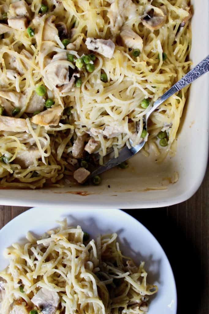 Turkey Tetrazzini, in casserole with serving in front on plate