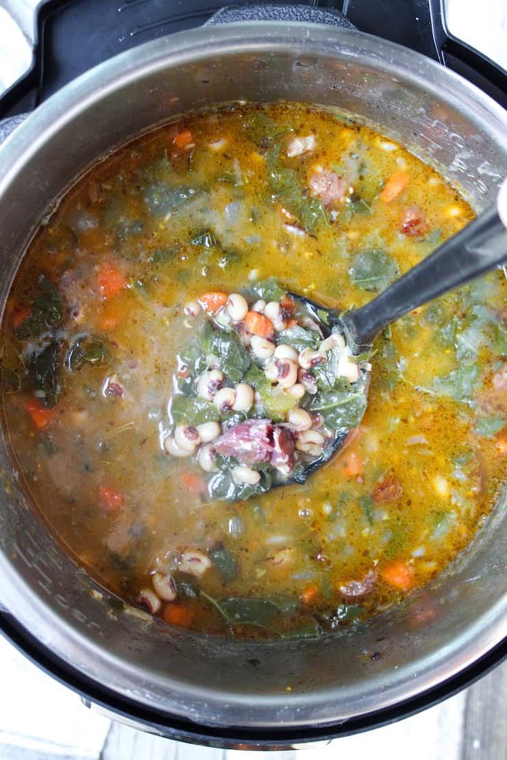 Soup in pot with ladle.