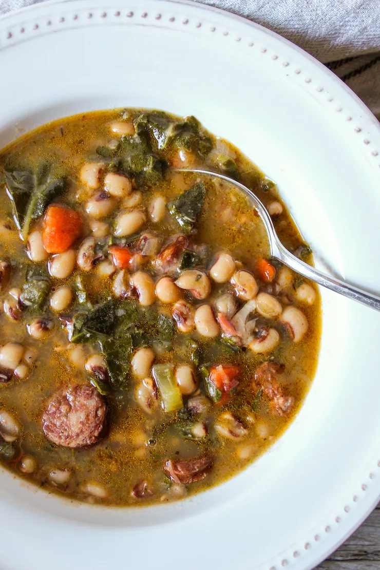 Soup in bowl with spoon.