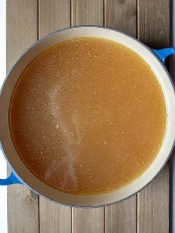 Instant Pot Chicken Stock, overhead of finished stock in stock pot, ready to cool.