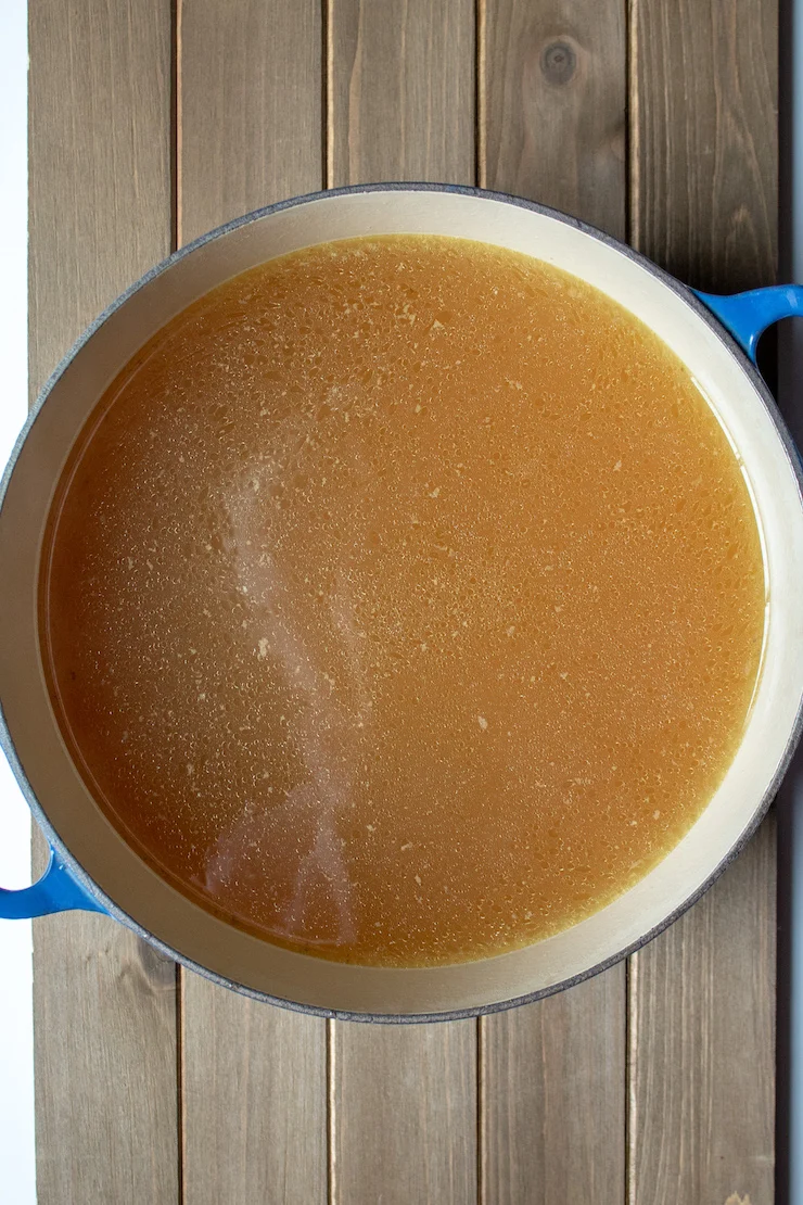 Instant Pot Chicken Stock, overhead of finished stock in stock pot, ready to cool.