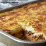 Pastitsio pin for Pinterest with text, baked in pan.