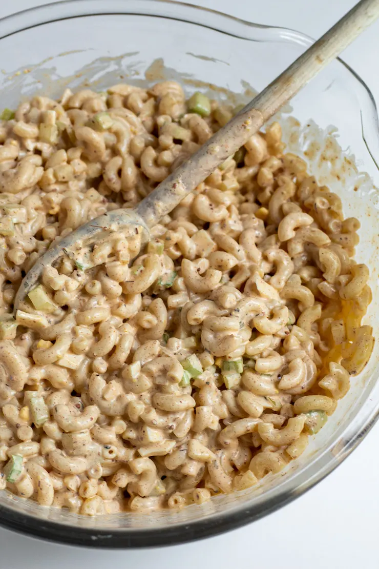 Cajun macaroni salad in mixing bowl.