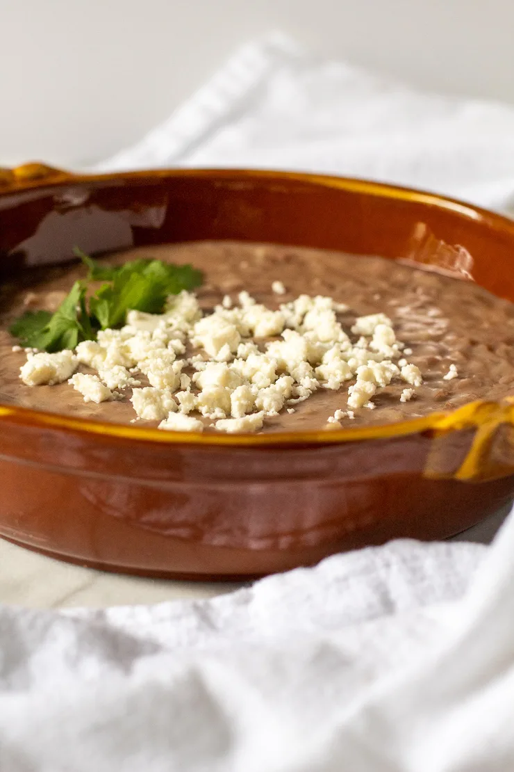 Sideview in serving dish with cheese on top.