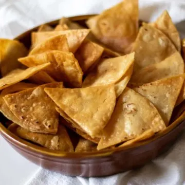 Homemade tortilla chips in bowl.