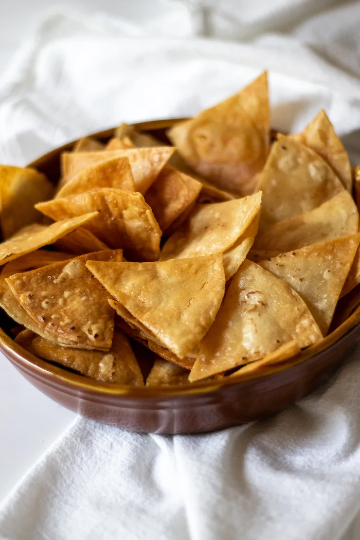 Homemade tortilla chips in bowl.