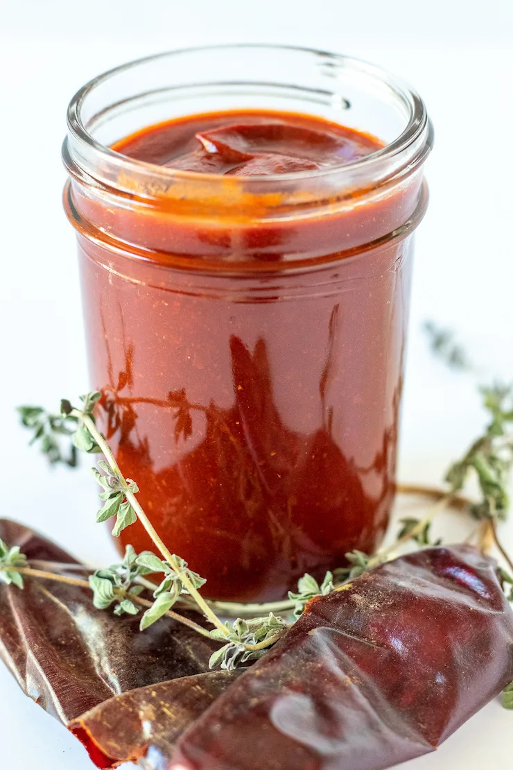 Enchilada sauce in jar for storage.