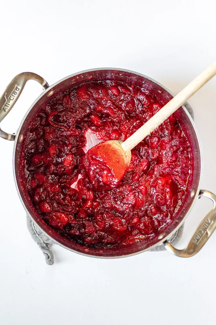 Cranberry sauce thickened in saucepan.