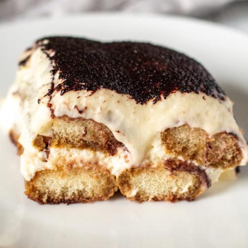 Side view of creamy layers and ladyfingers.