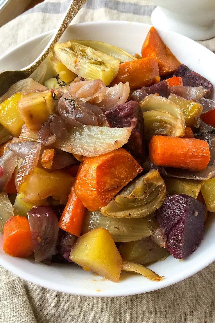 Close up of roasted root vegetables in bowl.
