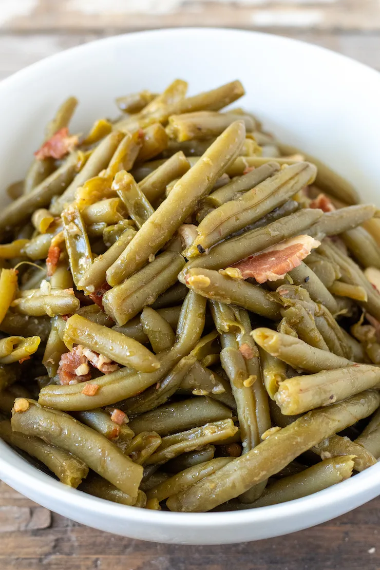 Southern style green beans in white bowl.