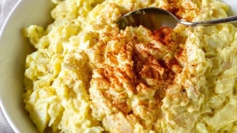 old fashioned potato salad with cooked dressing If you're not a fan of classic potato salad containing mustard and eggs, this Steakhouse Potato Salad is for you! It's packed full of flavor with a delicious creamy dressing, and it's