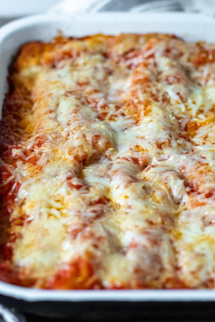 Pan of baked beef and cheese manicotti.