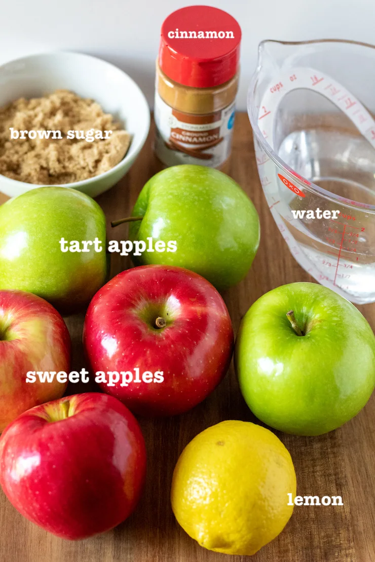 Ingredients for Instant Pot applesauce labeled on cutting board.