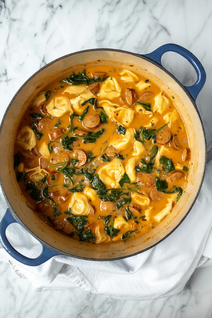 Creamy Cajun tortellini soup in pot.