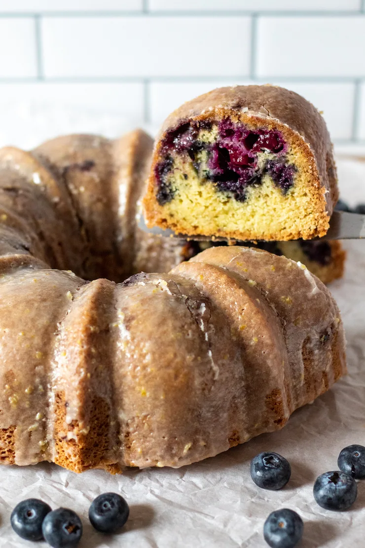 Serving slice coming out of Bundt cake.