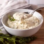Homemade tartar sauce in white serving bowl with spoon.