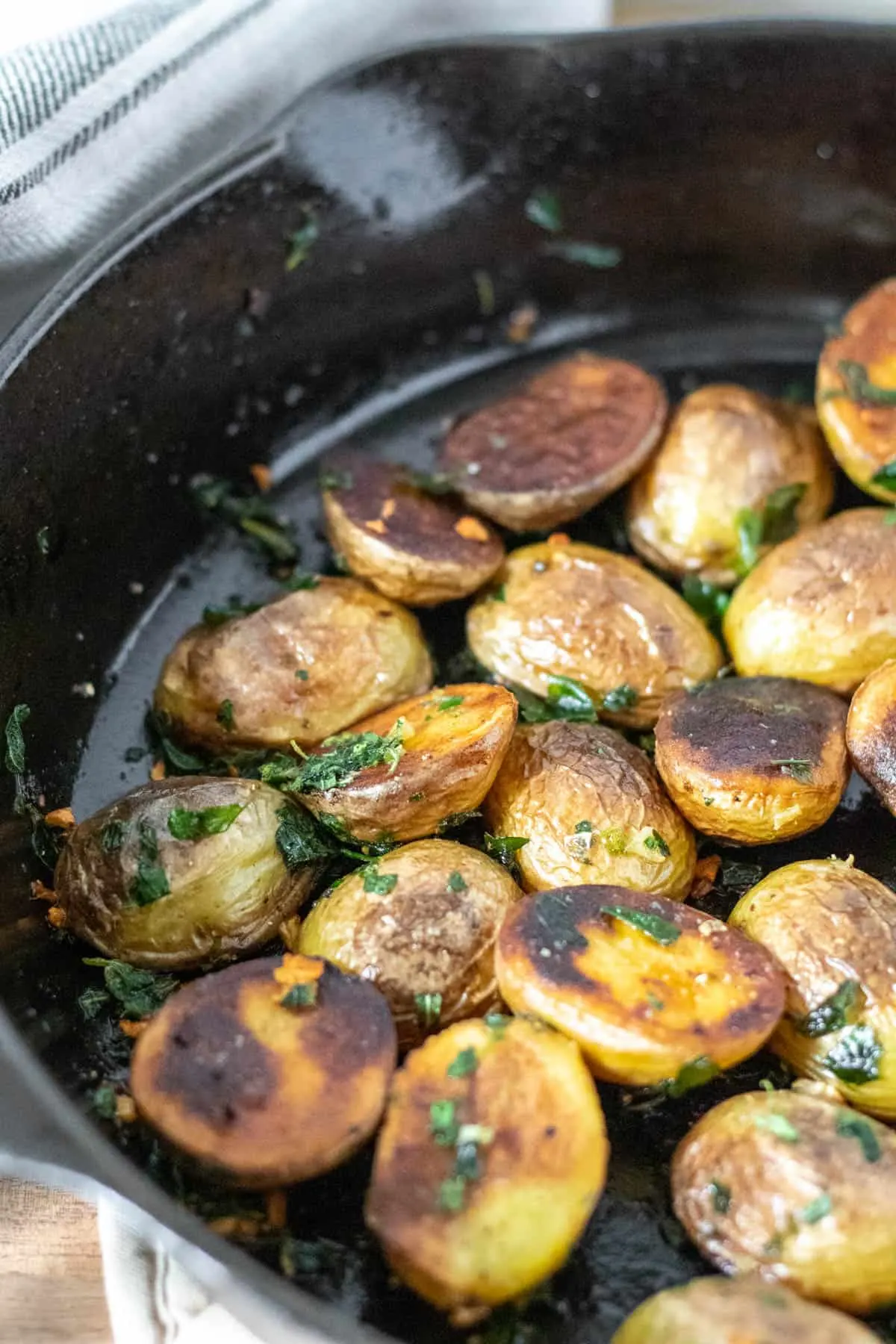 Crispy skillet potatoes in cast iron pan.