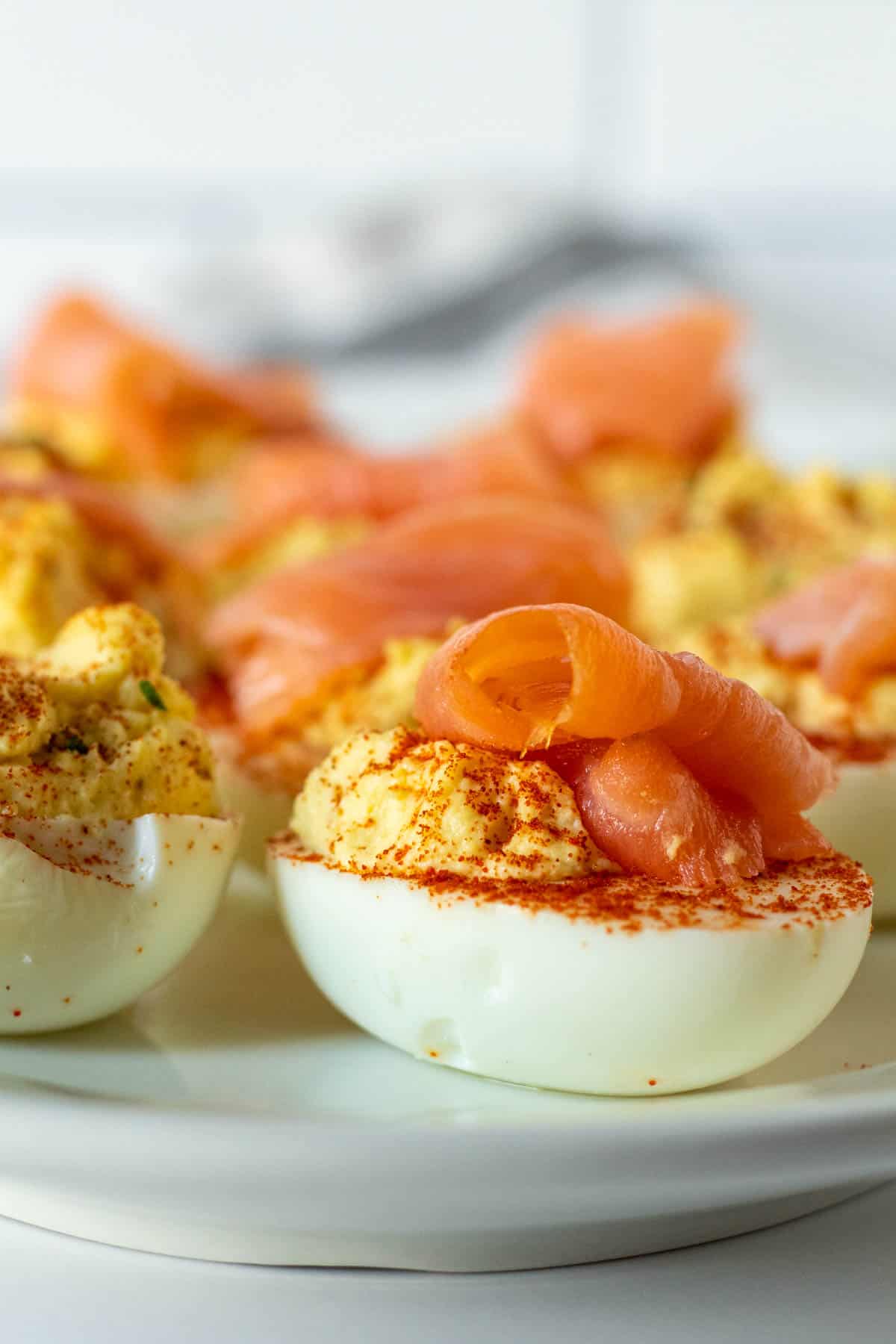 Close up of deviled egg topped with smoked salmon.